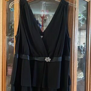 Cocktail dress. Tiered with a little stretch. Tank style. Added broach detail.